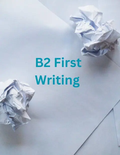 Two crumpled up pieces of paper lying on some sheets of paper with B2 First Writing written between them